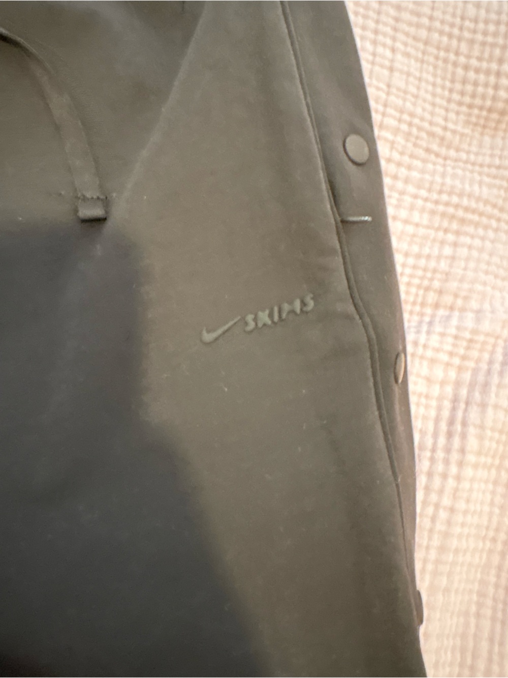 Nike Skims Brown Women’s Snap-Front Joggers with Subtle Logo
